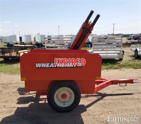 wheatheart skid steer post pounder|used wheatheart post hole digger.